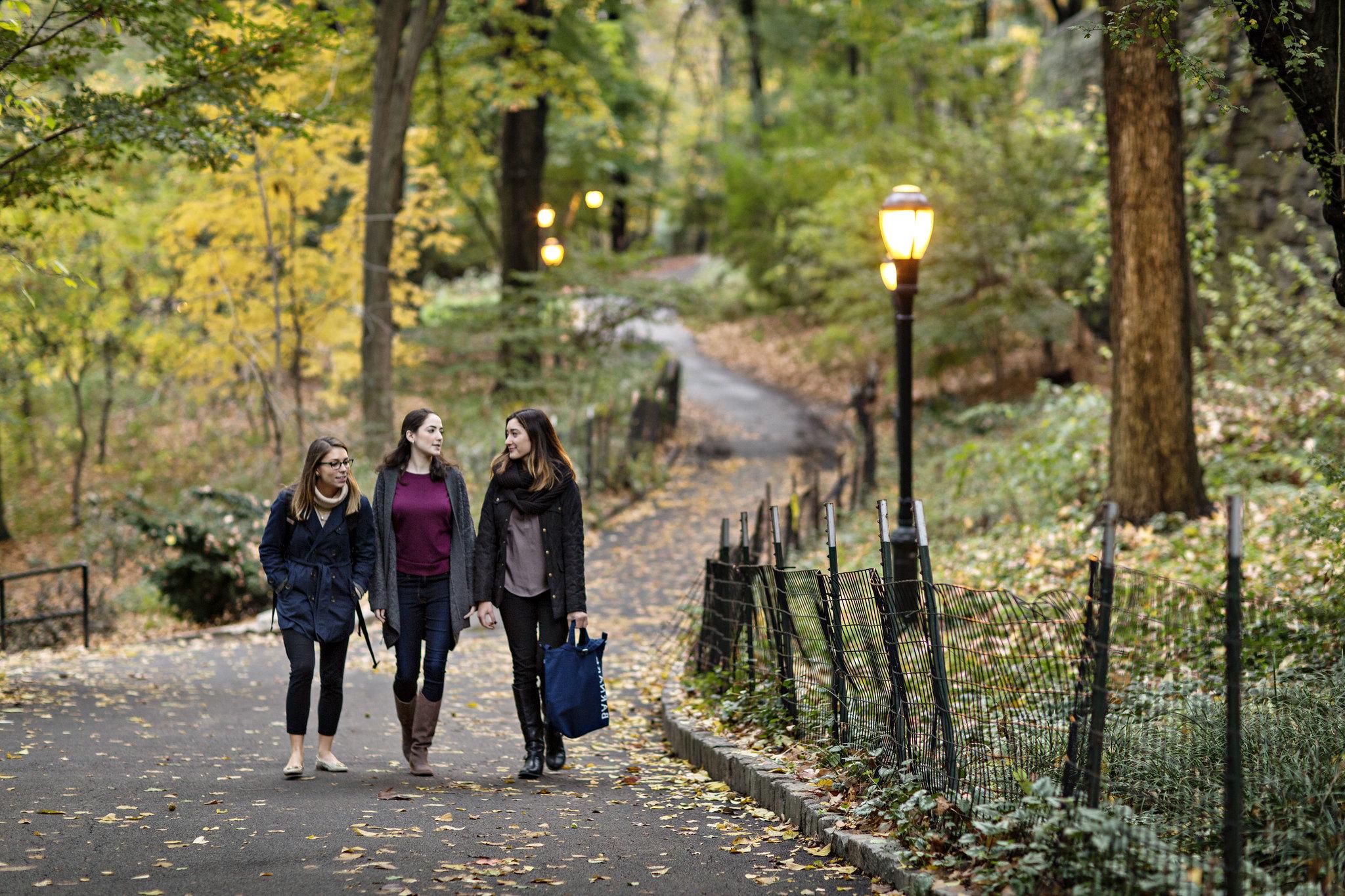Group of young women walking in the park.