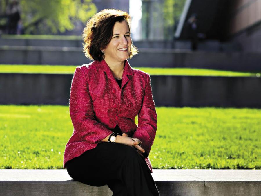 Provost Linda Bell sitting outside Barnard Campus
